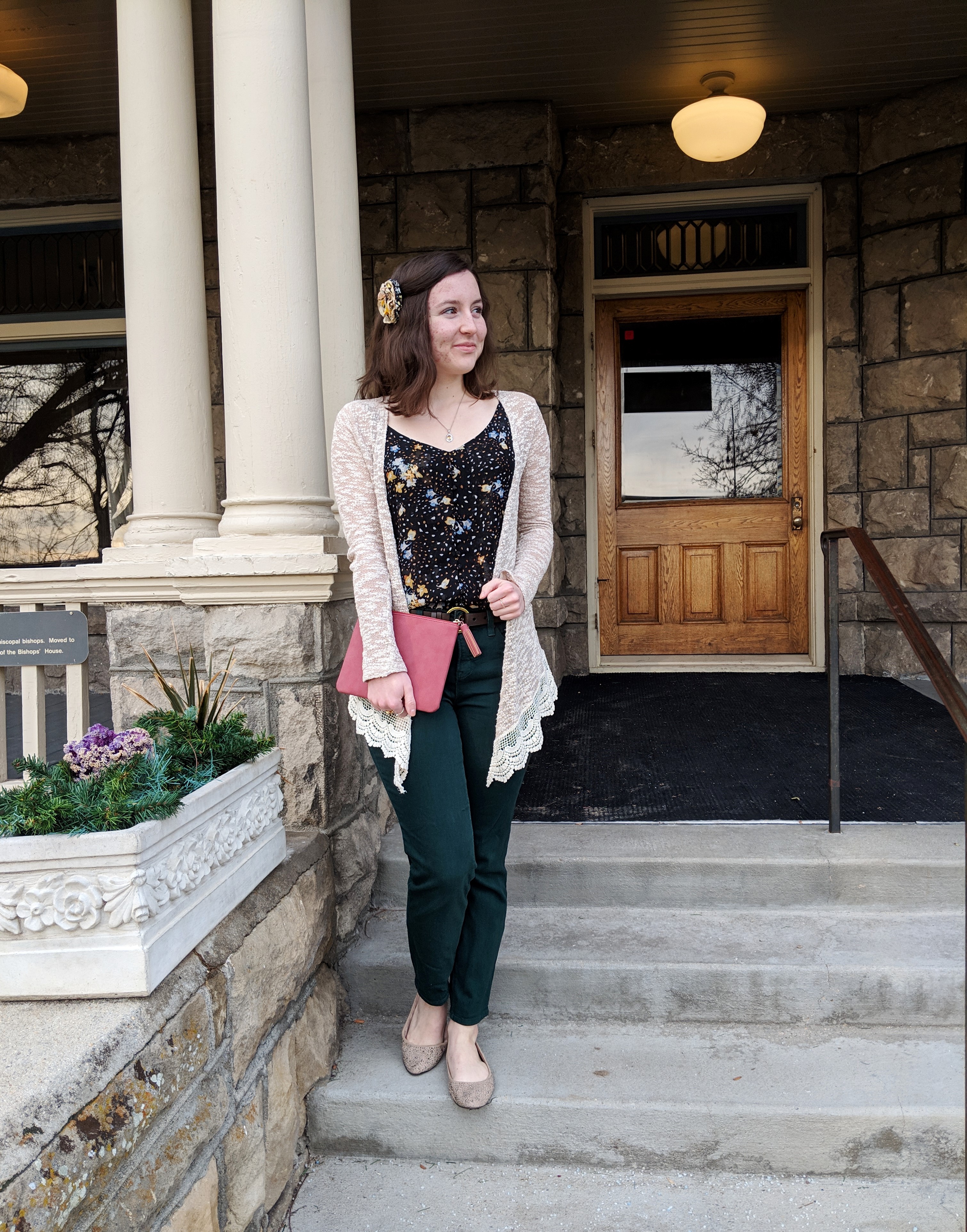 green pants with a floral tank top and beige cardigan