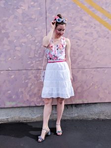 pink floral blouse, white skirt, striped heels