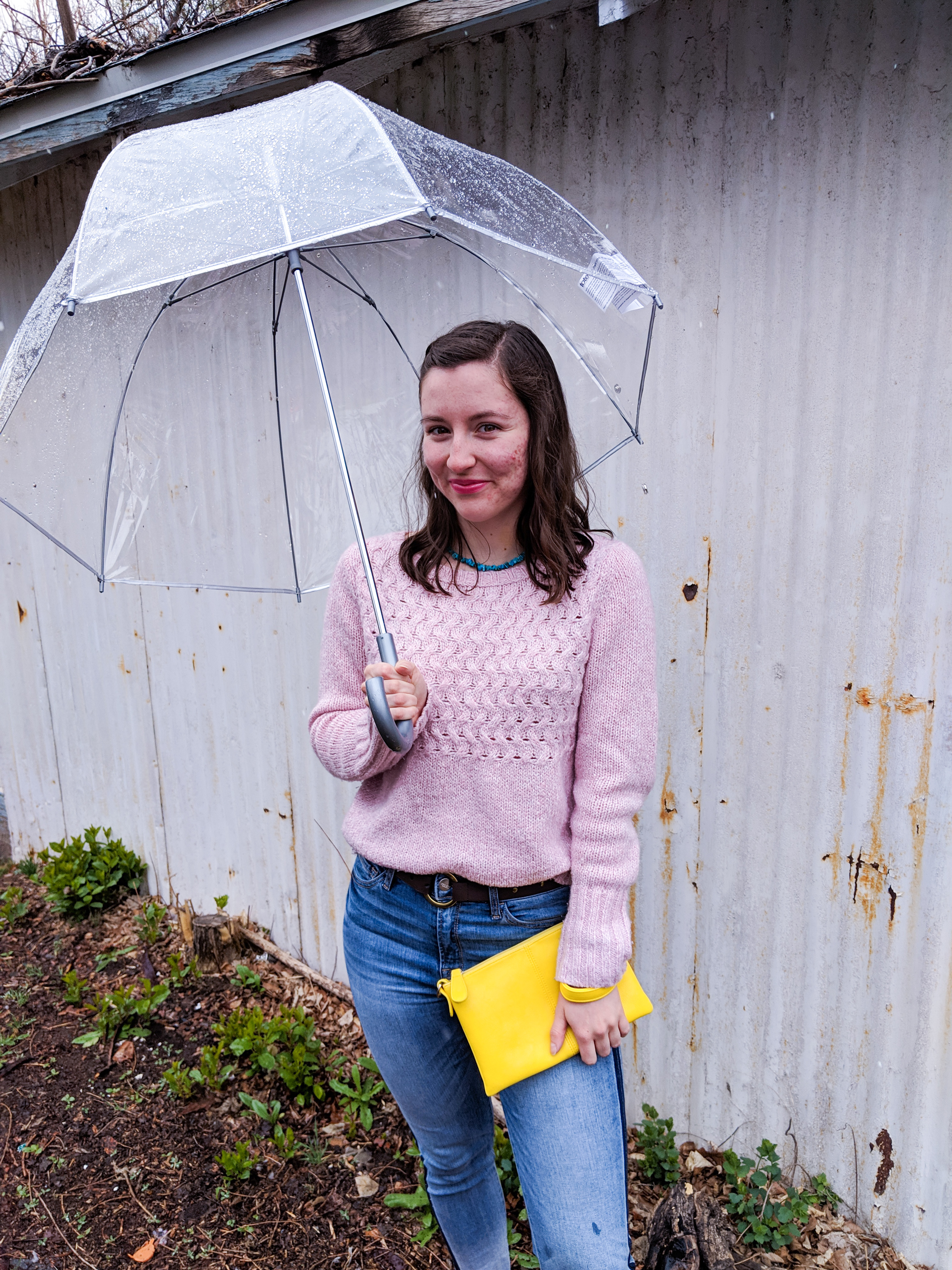 dancing in the rain, rainy day, clear umbrella, pops of color, yellow purse