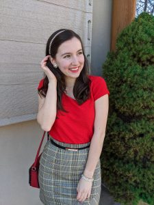 red blouse, plaid skirt, sparkly accessories