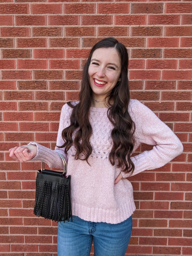 curled-hair-romantic-leather-purse-pink-sweater