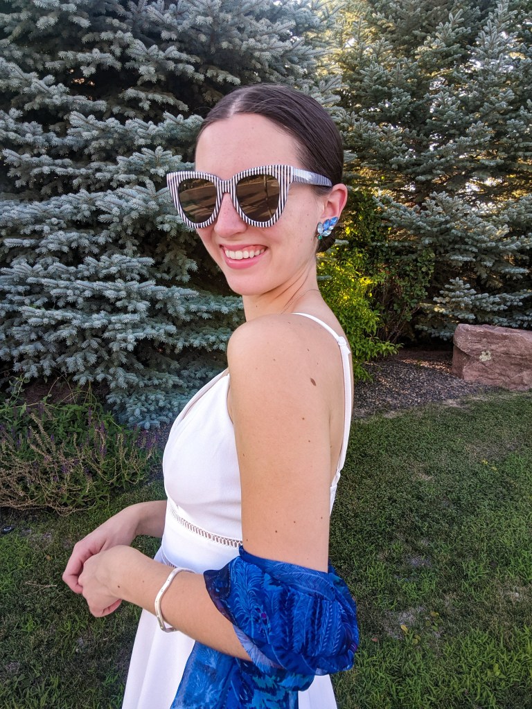blue-clip-on-earrings-striped-sunglasses-white-dress