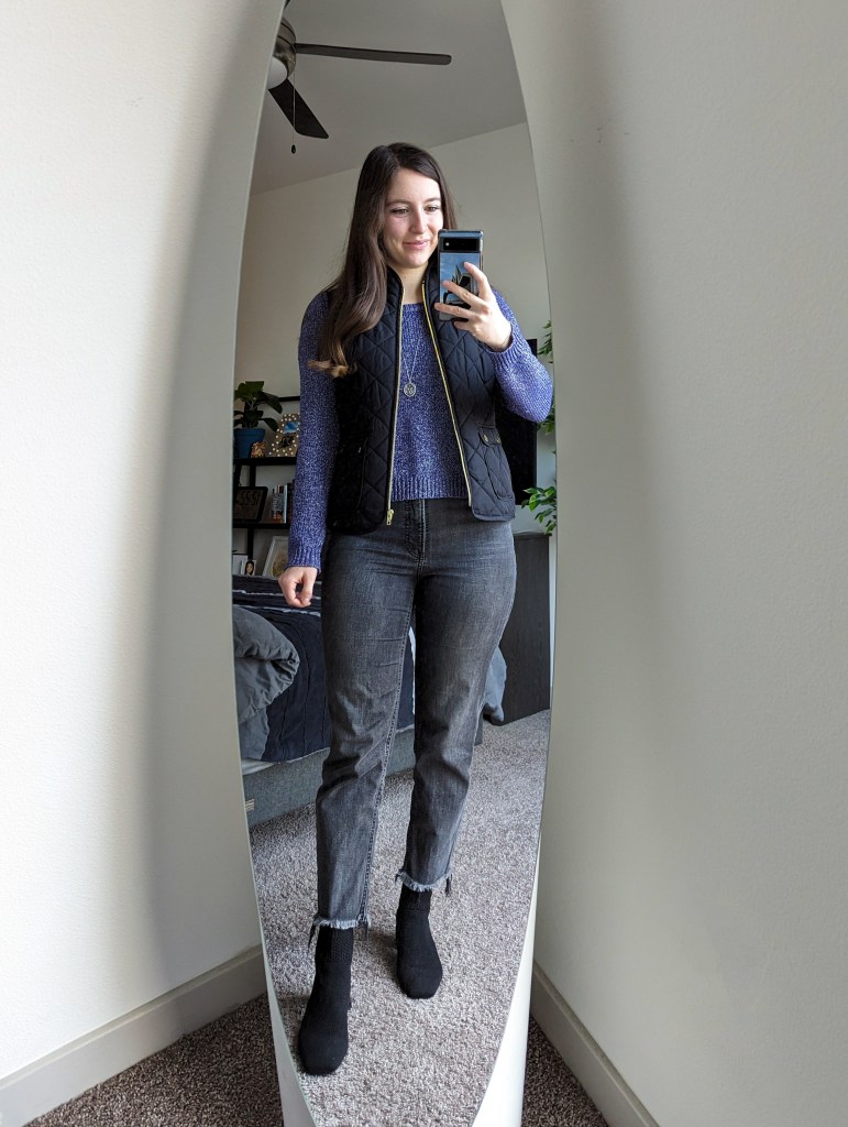 purple-sweater-black-quilted-vest-grey-straight-leg-jeans-black-booties