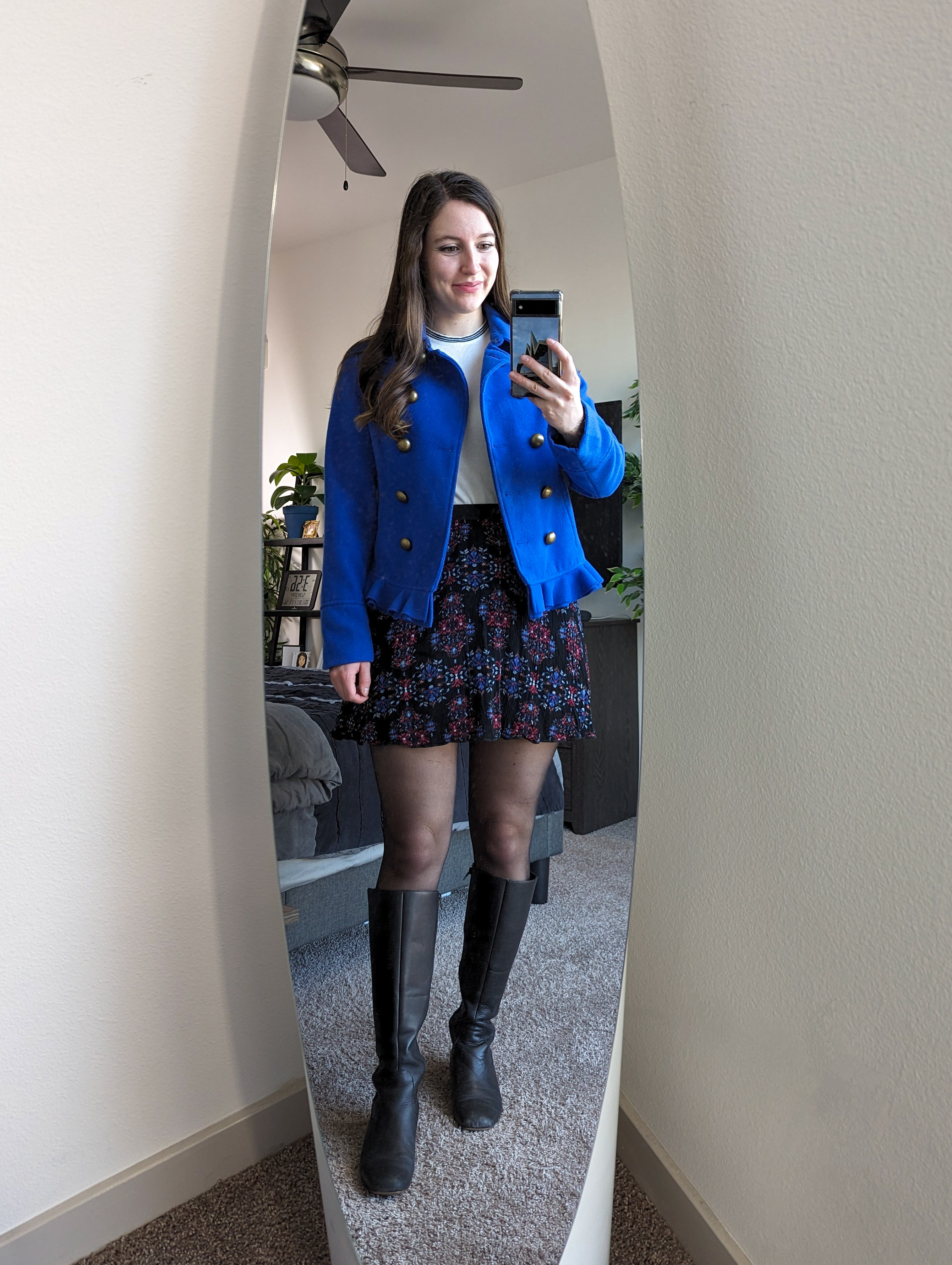 white-sweater-blue-peacoat-patterned-skirt-black-knee-boots